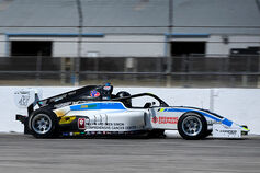 Race car with Simon Cancer Center advertised on it.